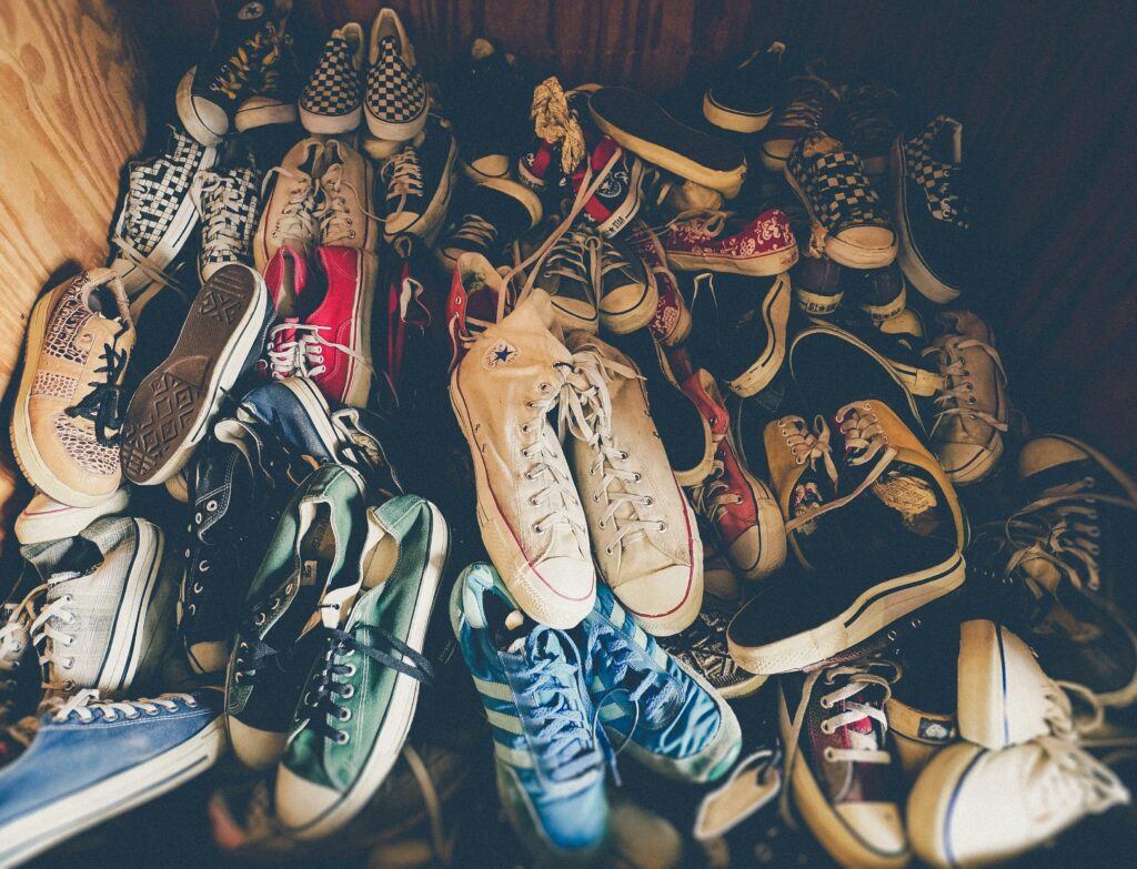 closet with a pile of unorganized shoes