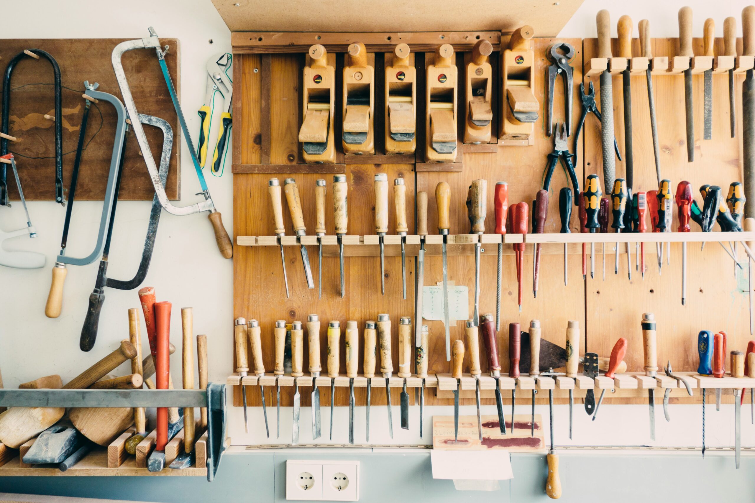 woodworking tools organized on the wall