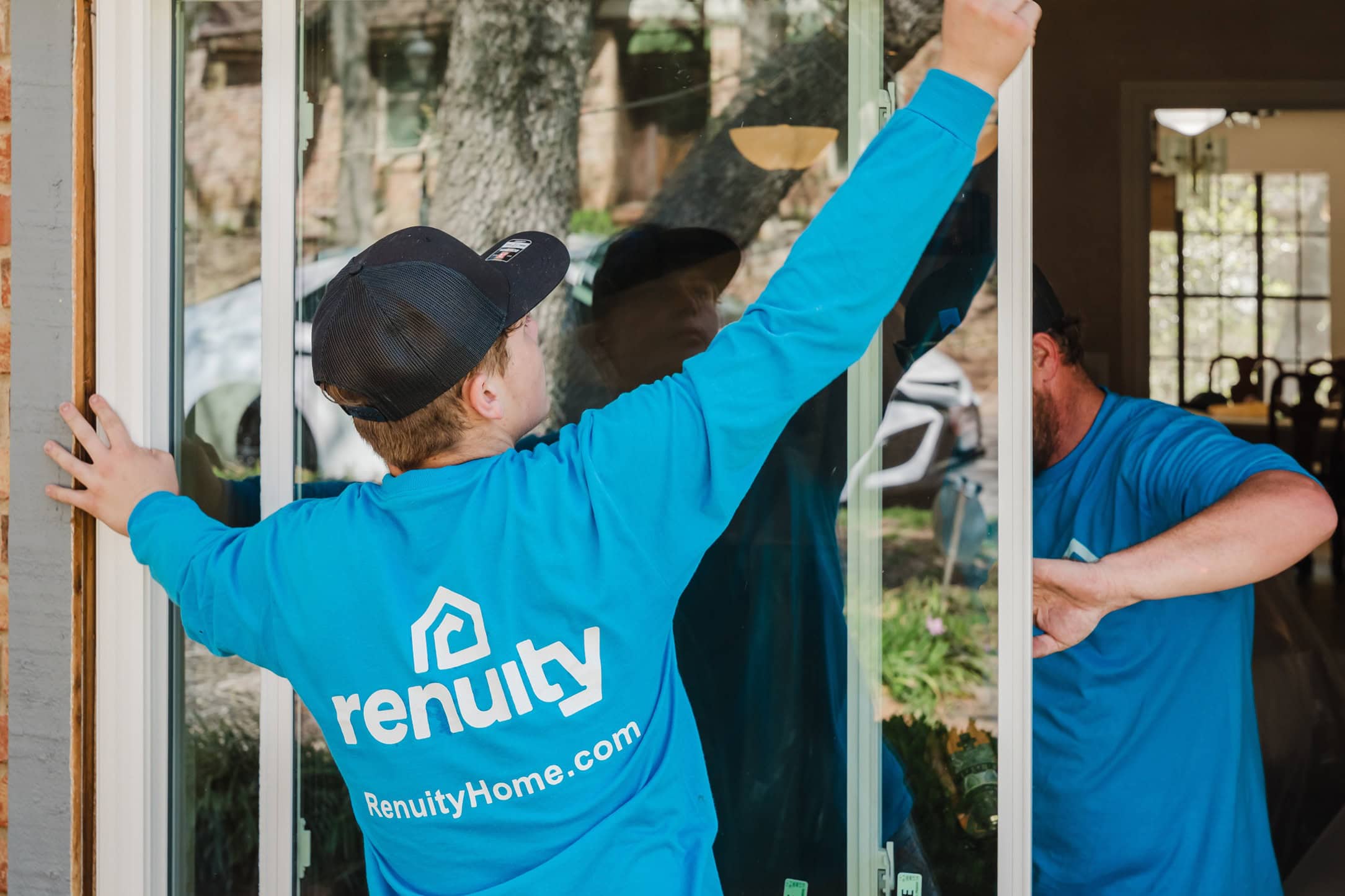 Renuity service team installing a new window
